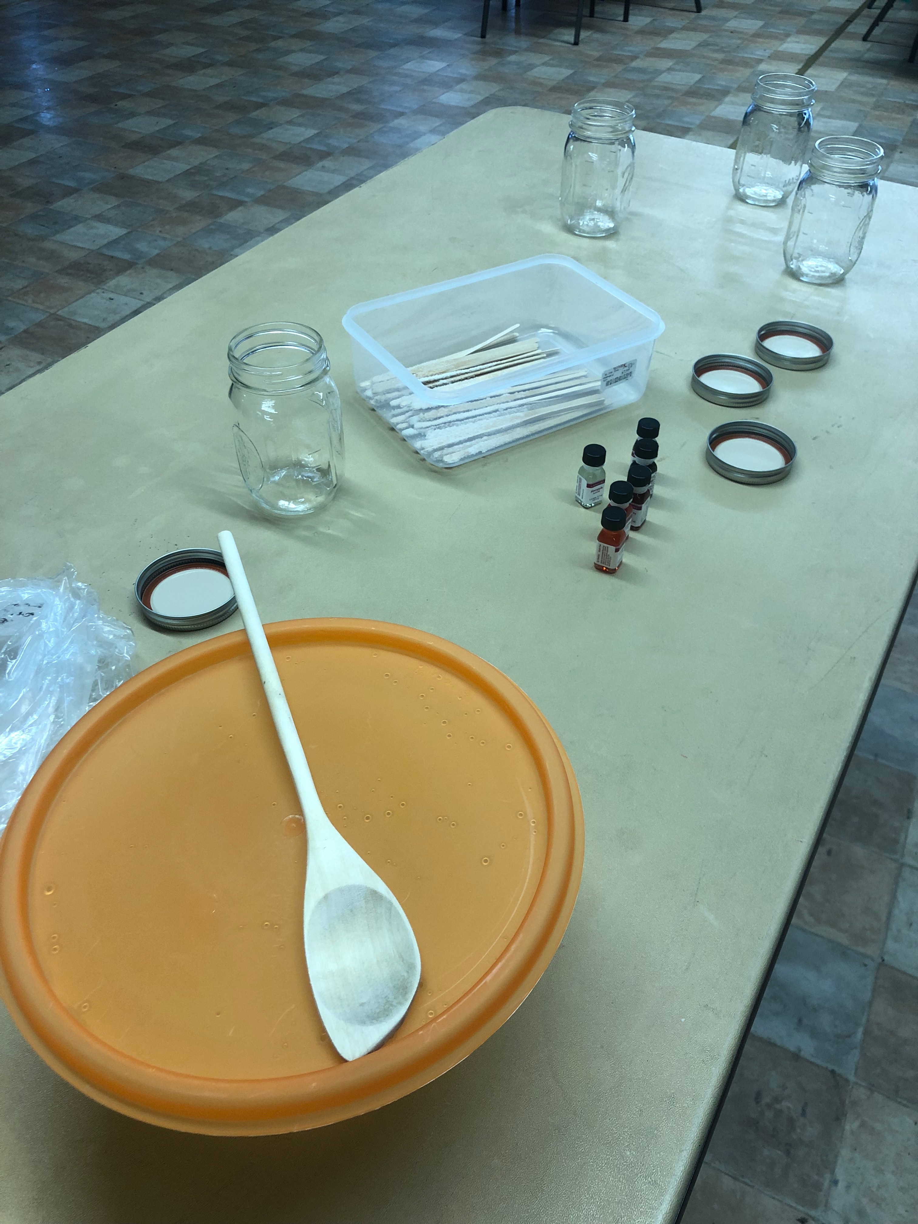 Supplies to make Rock Candy: Container of Simple Syrup, Glass Jars, Flavorings