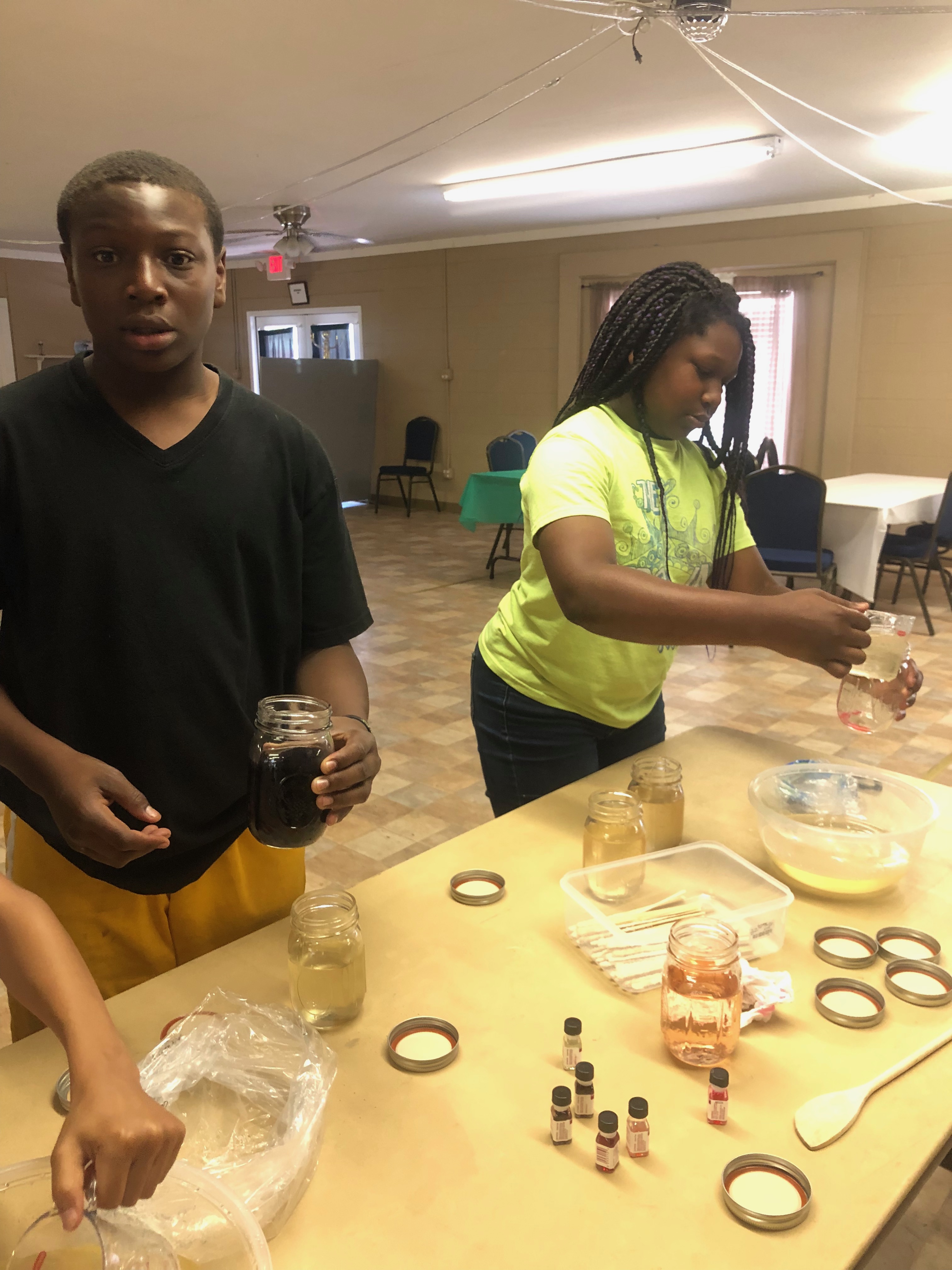 Children Making adding Flavorings to their Jars