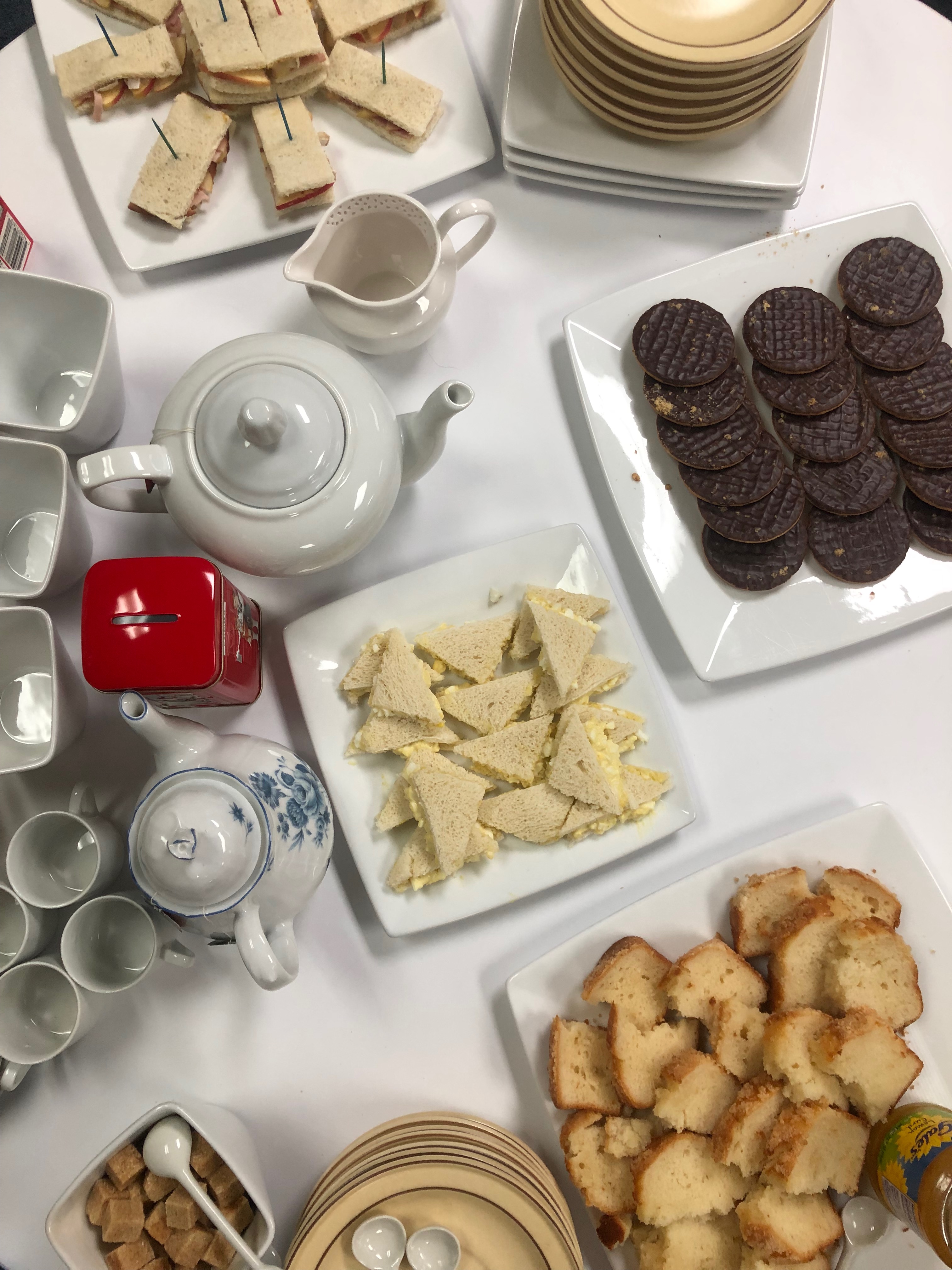 Afternoon Tea: Tea Cups, Tea Pots, Finger Sandwiches, Digestive Biscuits, Sponge Cake, and Lemon Curd