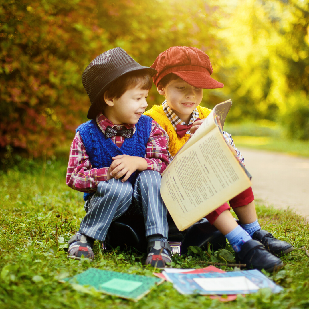 kids reading in the garden.