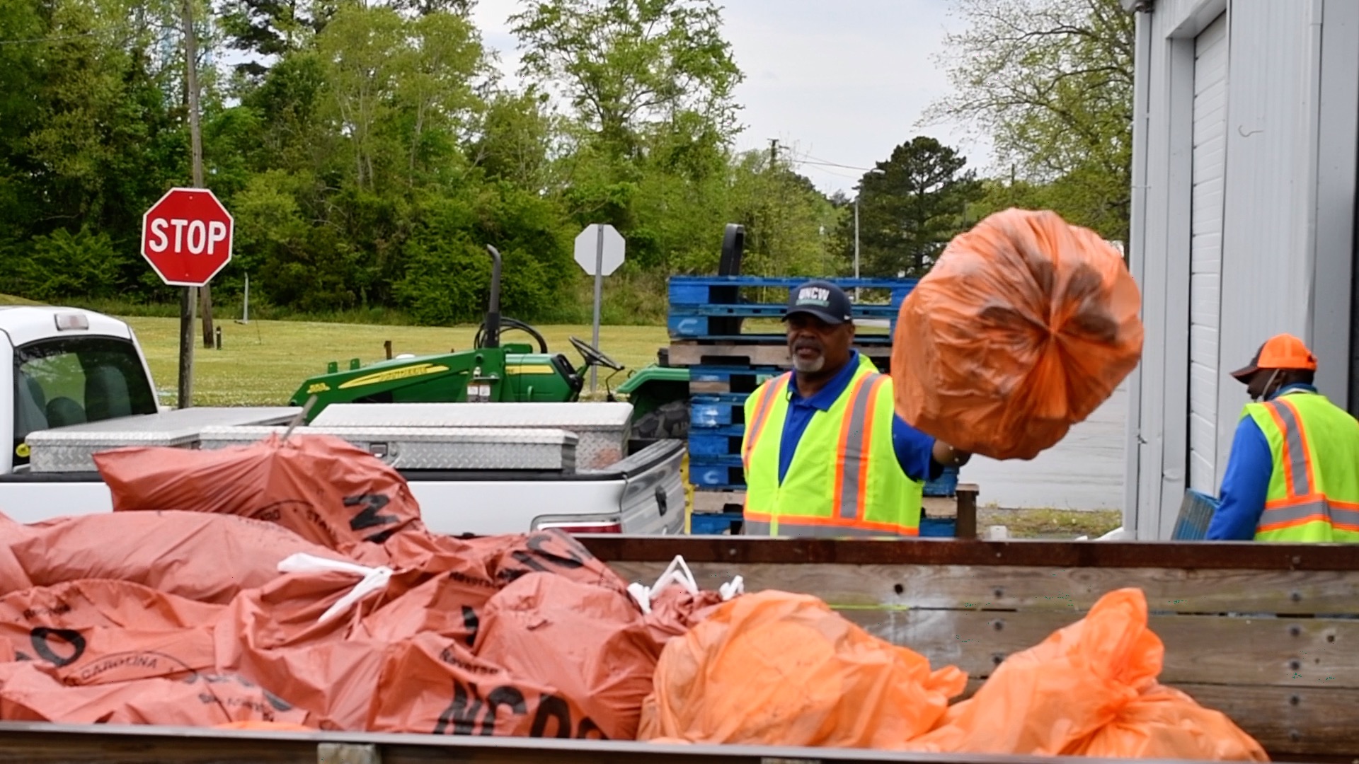 man with garbage bag during Clean Sweep